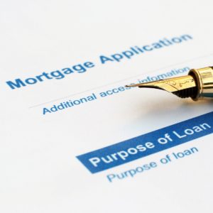 fountain pen lying on mortgage application
