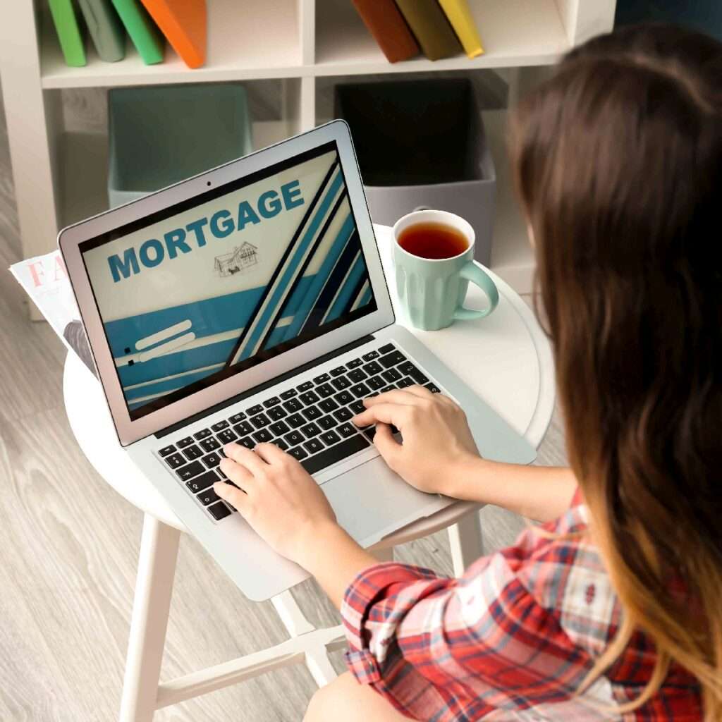 woman searches for mortgages on laptop